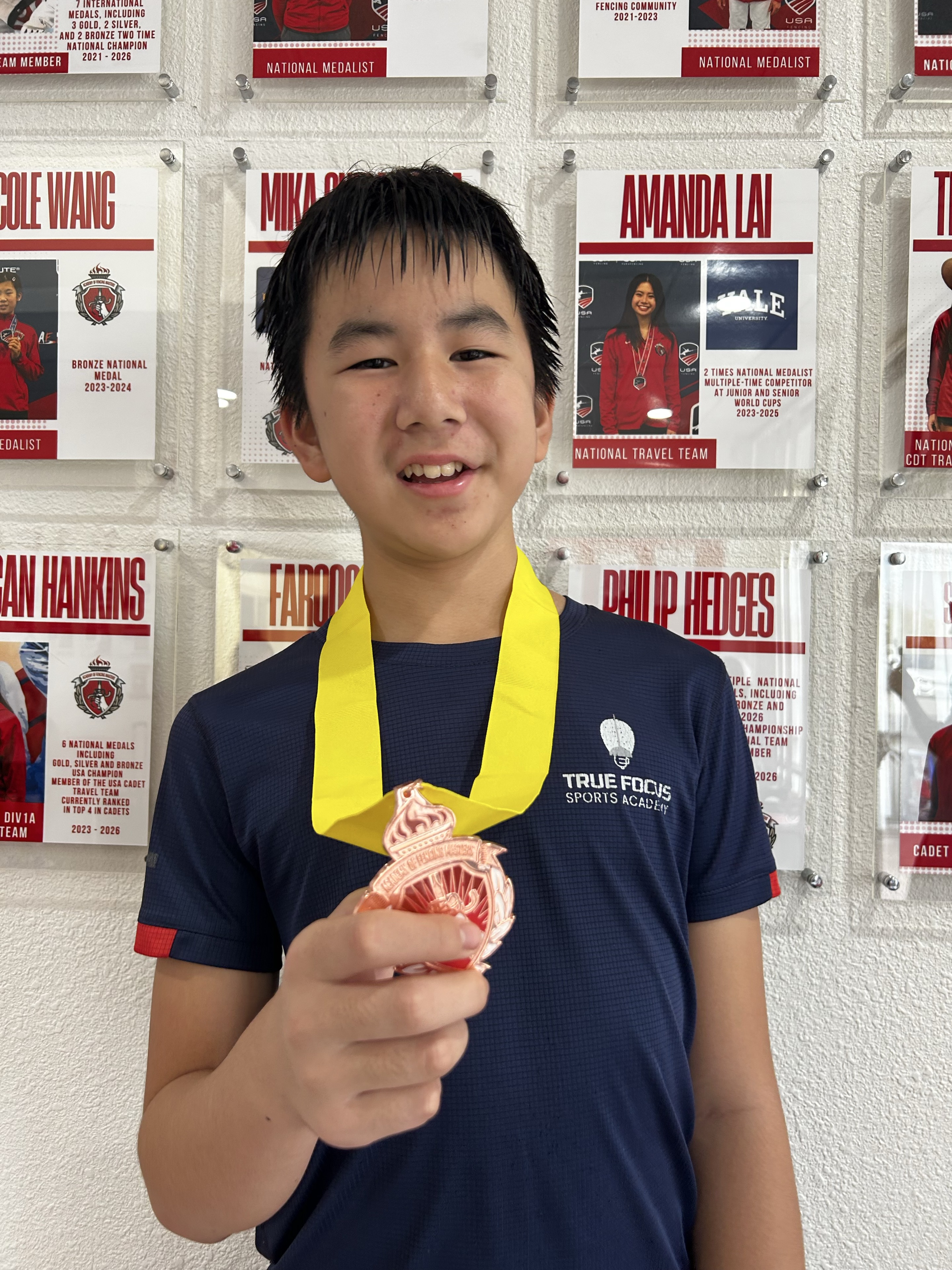 Nathan Li holding his bronze medal at AFM