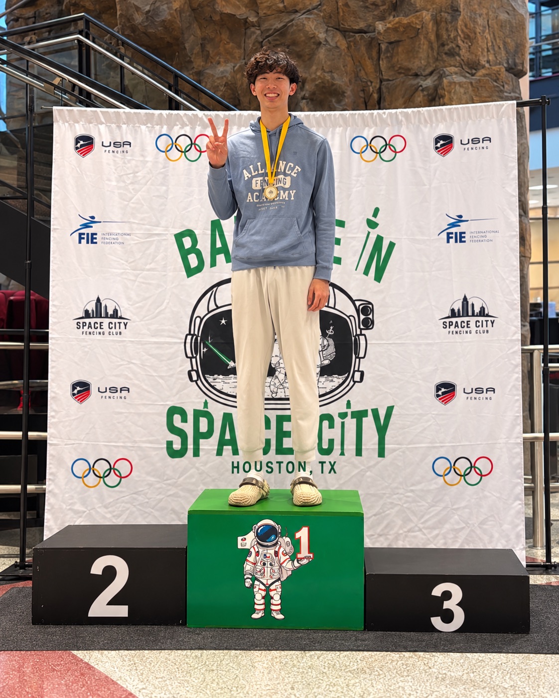 Timothy Xu on the first-place podium at Battle in Space City, Houston